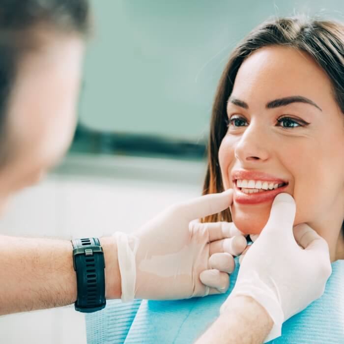 Dentist examining dental patient