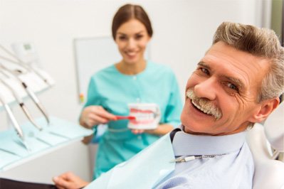 A man consulting with a dentist about dentures