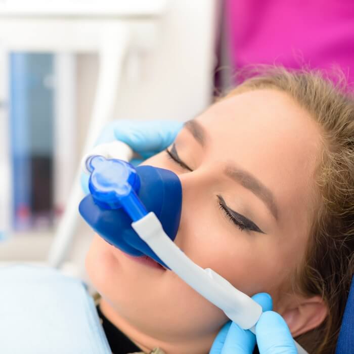 Dentistry patient receiving treatment under nitrous oxide dental sedation