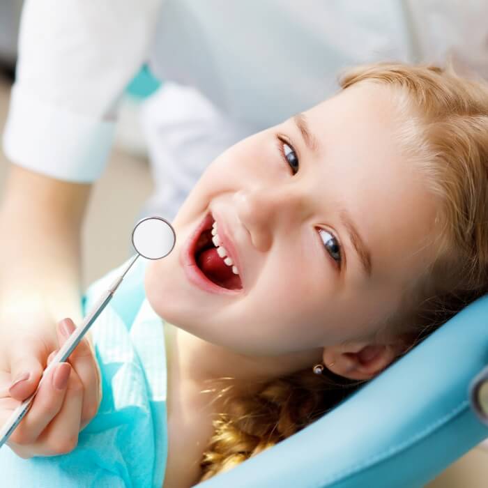 Smiling child during dental treatment
