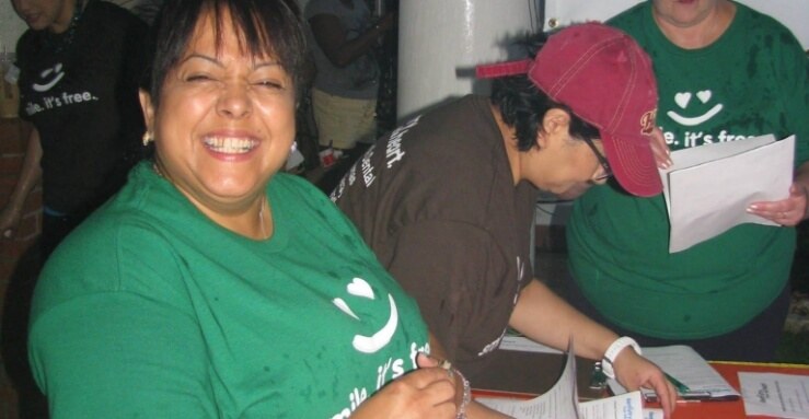 Dental team member laughing during volunteer event