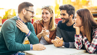 friends sitting, laughing, and talking