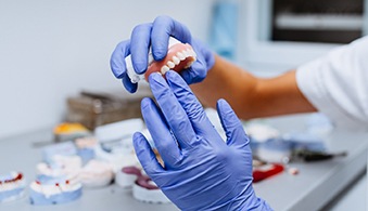 Lab technician working with dentures in Baytown, TX
