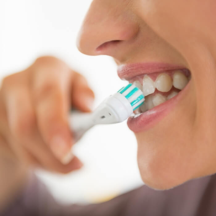 Perosn brushing teeth