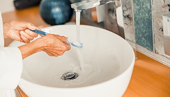 Toothbrush being rinsed