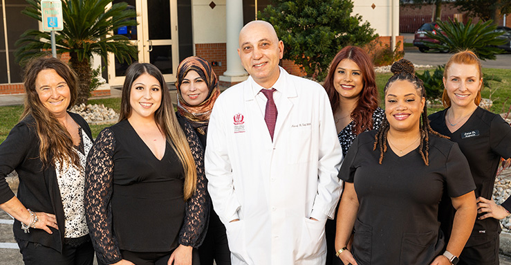 Smiling dentist and dental team at Baytown Gentle Dental