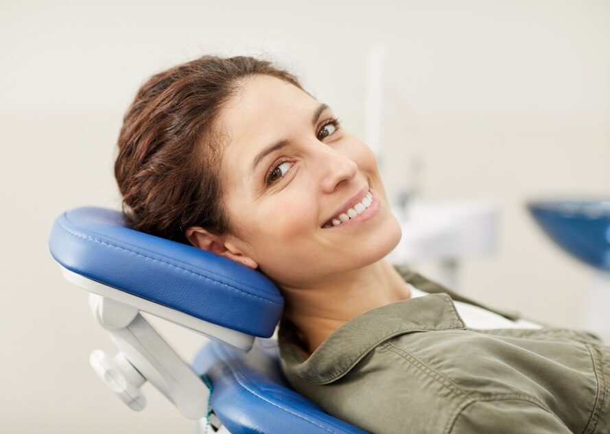 Woman in dental chair smiling