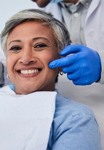 a patient smiling after undergoing cosmetic dentistry