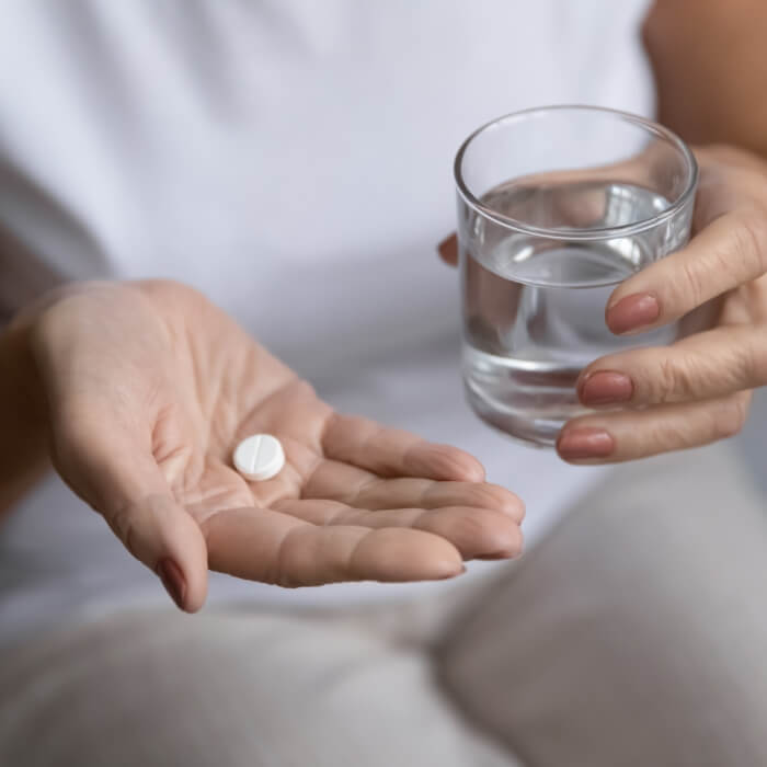 Dental patient taking oral antibiotic therapy pill