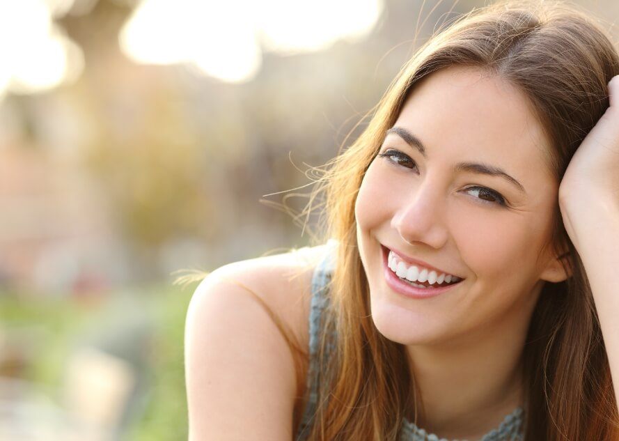 Woman smiling after preventive dentistry visit