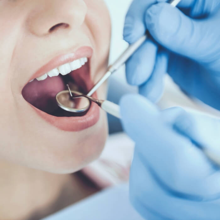 Dental patient receiving an oral cancer screening