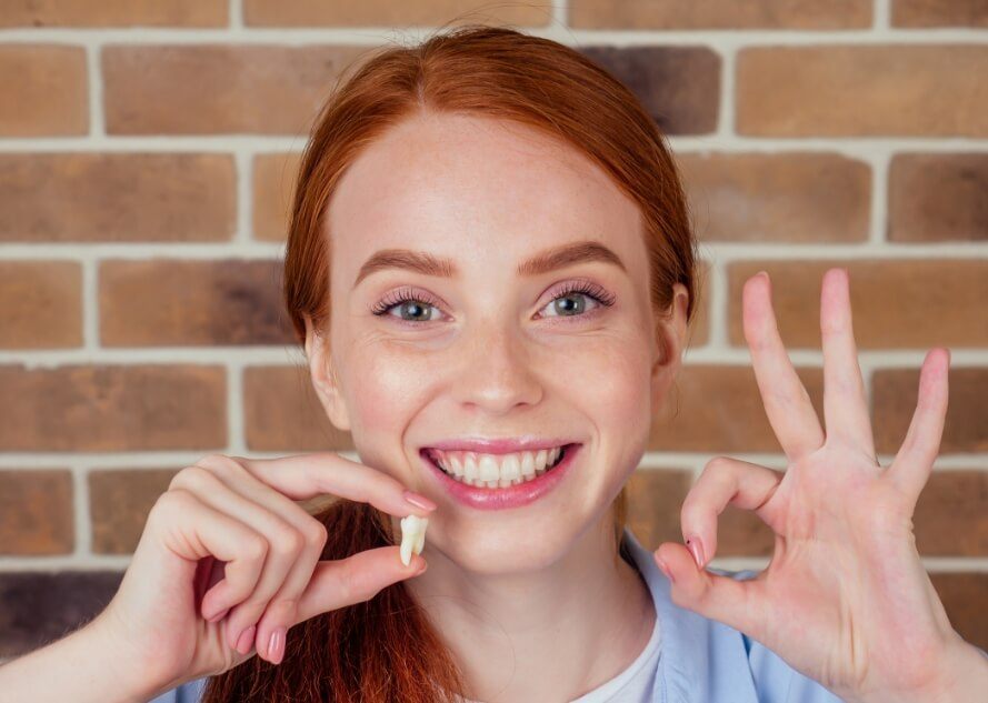 Woman smiling after restorative dentistry treatment