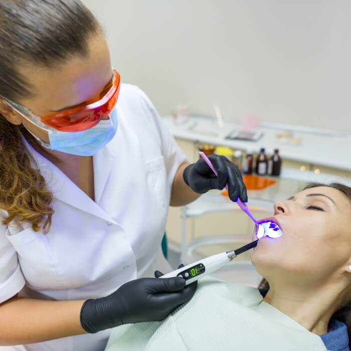 Dental patient receiving treatment under oral conscious sedation dentistry