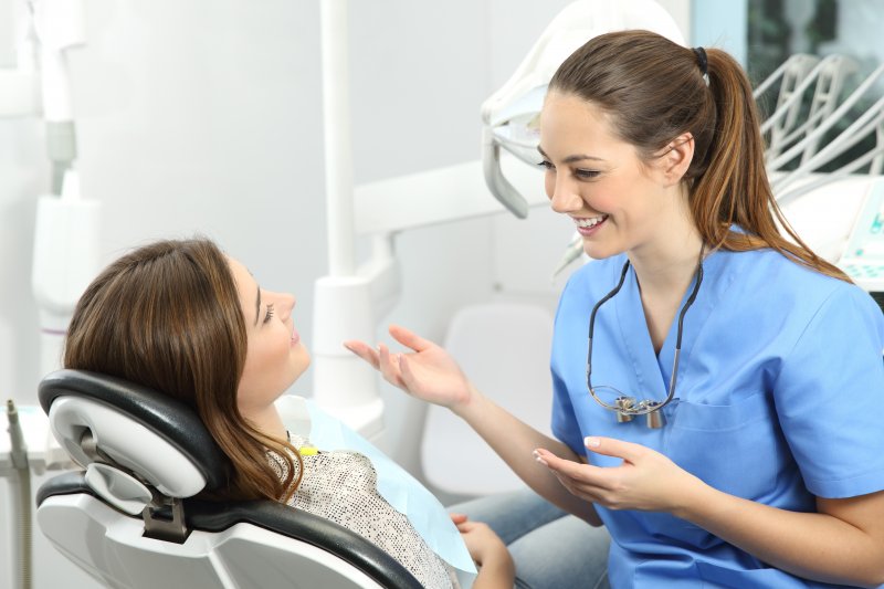 person speaking with cosmetic dentist